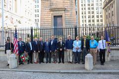 Group of people posing for a photo in front of the historic Battle Monument