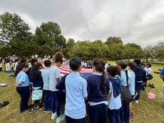Living Historians and Park Rangers giving a flag talk to children at Patterson Park