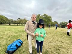 Living historian engaging children in historical storytelling at Patterson Park