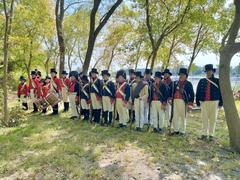 Living historians reenacting along the natural shoreline at Todd's Inheritance historic site