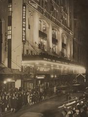 Opening night at the State Theatre in Sydney in 1929 capturing a large crowd gathered outside the illuminated venue