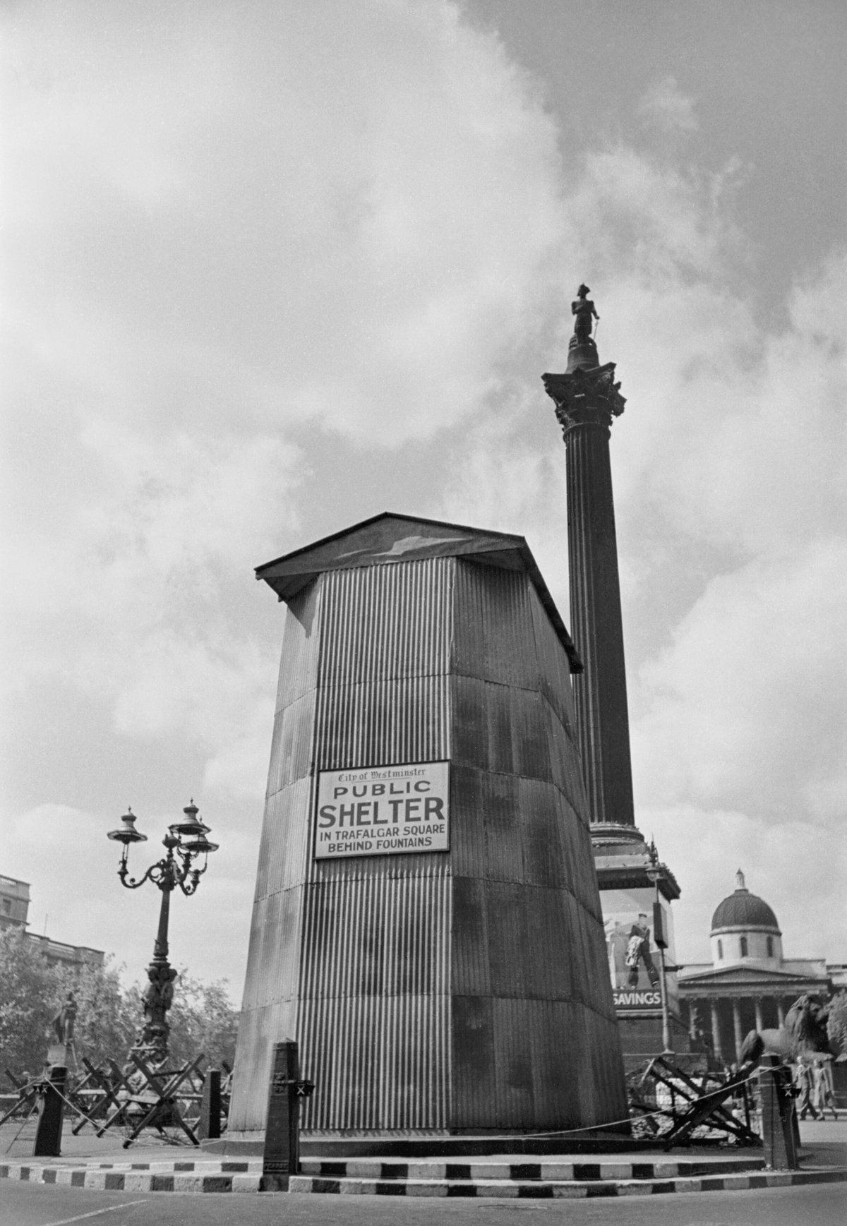 King Charles I statue in Whitehall London protected with timber frame sandbags and corrugated iron during 1941 air raid precautions