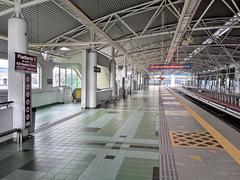 Sungai Besi LRT platform level in Kuala Lumpur with passengers and trains