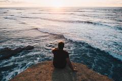 Sunset Cliffs scenic view at sunset with ocean waves and vibrant sky in San Diego