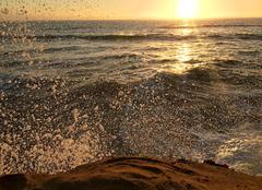 Sunset Cliffs coastline with ocean waves splashing during sunset in San Diego