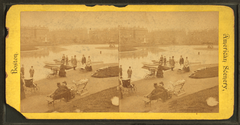 Vintage boat landing on a river with several rowboats and wooden pier