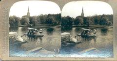 Excursion boats on the lake in Boston Public Garden surrounded by greenery