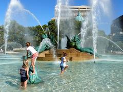 Children playing in Swann Memorial Fountain in Logan Square Philadelphia