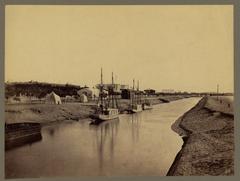 Freshwater canal at Ismailia with boats and trees along the banks