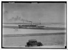 Ship passing through the canal in Ismailia, Egypt viewed from monument terrace