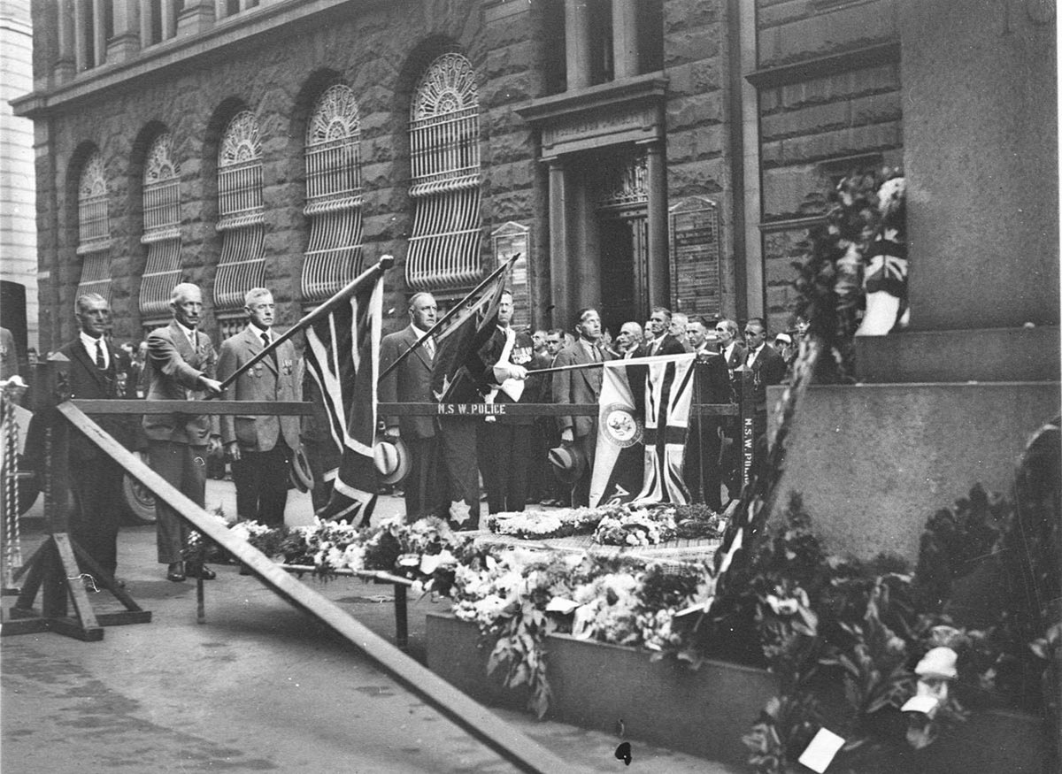 Flag bearers lowering their standards at the Cenotaph during a ceremonial event, Sydney, circa 1931
