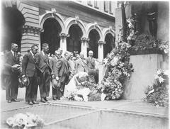 Civilians laying wreaths on Cenotaph during a remembrance ceremony