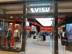 Shopping area outside Taikoo Hui mall at 383 Tianhe Road in Guangzhou, Guangdong, featuring Evisu clothing store in October 2024