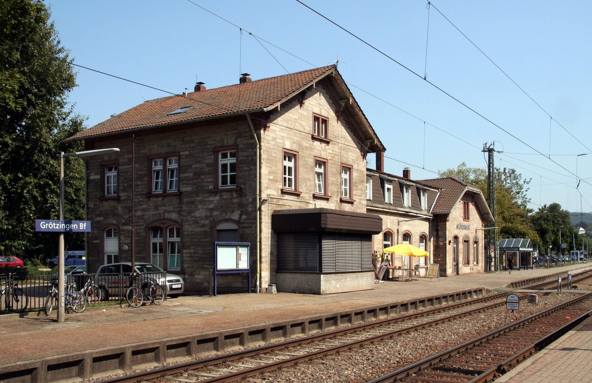Train station building of Grötzingen with railway tracks