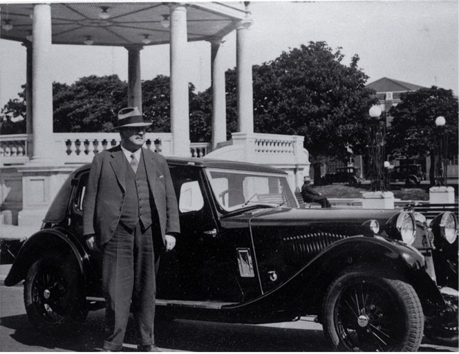 Albert Edward Armstrong with Riley Nine Kestrel car outside Edmonds Band Rotunda Christchurch