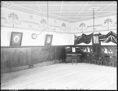 Interior of Sir John Logan Campbell's kindergarten with piano and chairs