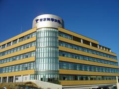 Teikyo University of Science Senju Campus building with people walking in front