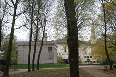 Front view of the Temple of Human Passions with intricate stone columns and sculptures