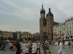Historic cityscape of Kraków, Poland featuring colorful buildings and a church tower