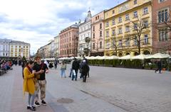 Main Market Square in Kraków bustling with people and historic architecture