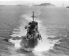 USS Clarion River LSMR-409 sailing in San Francisco Bay with Alcatraz Island and Bay Bridge in background