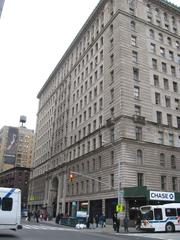 The Apthorp apartment building viewed from Broadway median across 79th Street on a cloudy afternoon