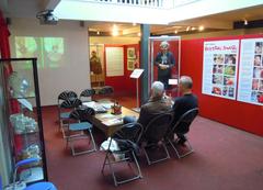 Interior of The Cartoon Museum main display area with comic art on walls