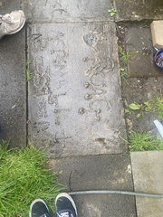 Roag and Mona Best's names etched into concrete outside Casbah Coffee Club