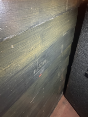 John Lennon's name carved into the wall of the Casbah Coffee Club