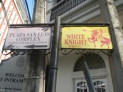 Intramuros landmarks including Aduana Gap Palacio del Gobernador in front of Manila Cathedral with historical bell tower and Plaza de Roma