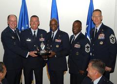 Gen. C. Robert Kehler presenting the General Thomas S. Moorman Jr. Award to 45th Space Wing leaders at AFSPC Heritage dinner