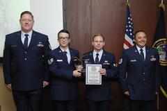 U.S. Air Force members of the 223rd Space Communication Squadron receiving 2014 Department of Defense Chief Information Officer Nuclear Command Control and Communications Team Award