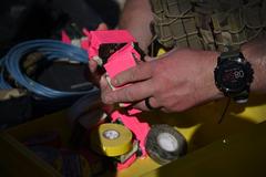 Air Force member from 21st Civil Engineer Squadron Explosive Ordnance Disposal preparing C-4 explosives for training at Fort Carson Airburst Range
