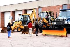 Civilian families viewing static equipment at 21st Civil Engineer Squadron open house at Peterson Air Force Base