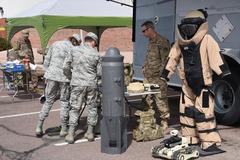 21st Civil Engineer Squadron explosive ordnance disposal technician explaining equipment at open house on Peterson Air Force Base