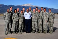 First sergeants in uniform forming on flight line at Peterson Air Force Base