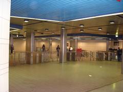 Mezzanine level of North York Centre subway station in Toronto with ticketing area and passengers