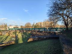 Ruins of the Aquincum Amphitheater in Budapest under blue sky