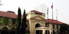 Entrance Gate of Philippine General Hospital with sign and security post