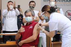 Philippine General Hospital Director Dr. Gerardo Legaspi receiving first CoronaVac COVID-19 vaccine inoculation