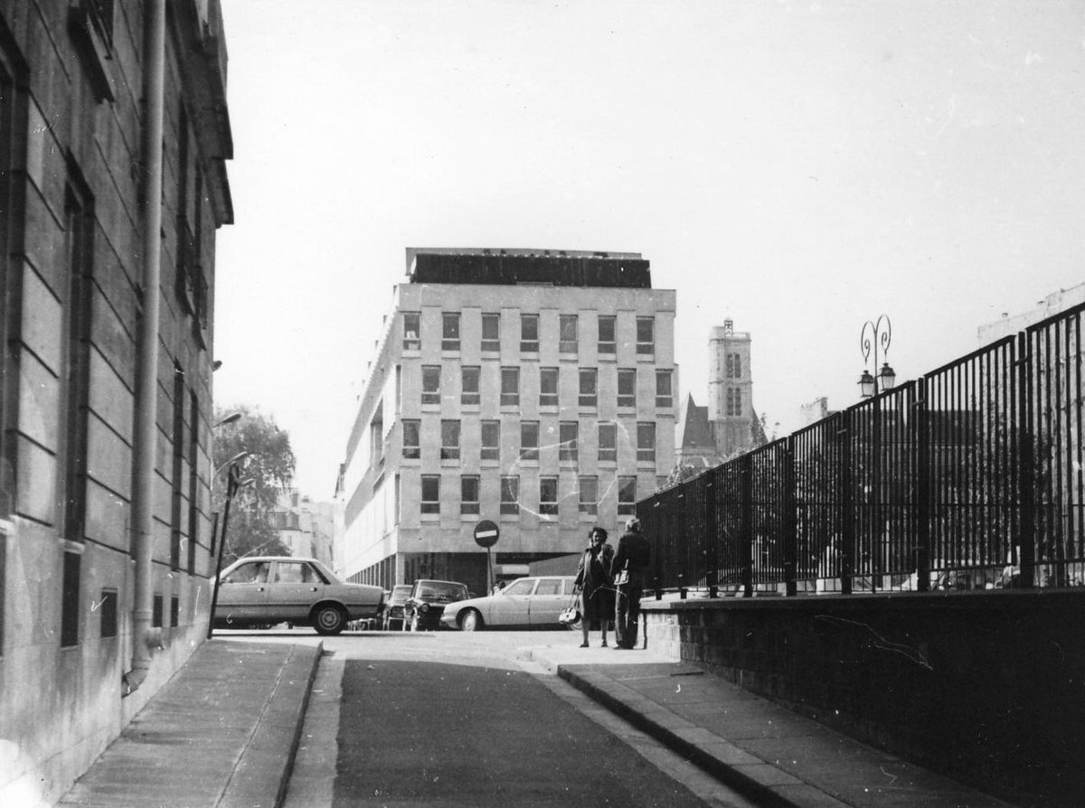 Crossroad of rue de l'Hôtel de Ville and rue de Fourcy in Paris with gates of Hôtel de Sens gardens and Cité Internationale des Arts building in 1981