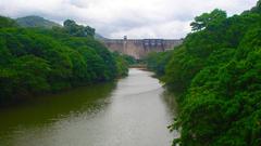 Thenmala Dam scenic view with lush greenery and water reservoir