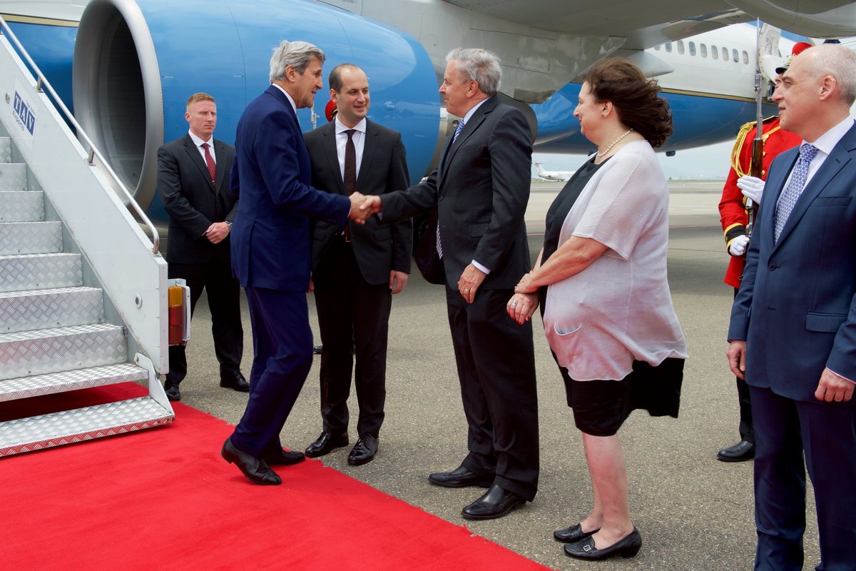 U.S Secretary of State John Kerry shaking hands with U.S. Ambassador to Georgia Ian Kelly at Tbilisi International Airport in Georgia on July 6, 2016