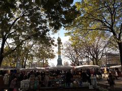 View of Place de la Bastille with Parisian market stalls in foreground