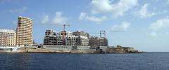 Hotels under construction in Sliema Malta with cranes and building structures