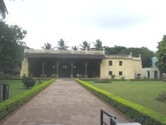 Tippu Sultan's summer palace located in Bangalore, featuring traditional Islamic architecture with ornate arches and wooden latticework