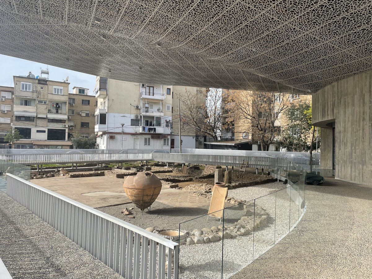 Ancient Roman villa mosaic displayed at a pavilion outdoor exhibition in Tirana, Albania