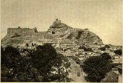 Historic illustration of Trichinopoli and the Golden Rock in Madras District, Southern India showing the cityscape with the shrine-capped Golden Rock and central jail