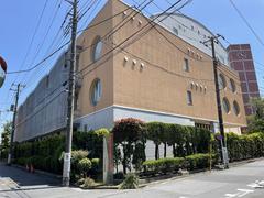 Tokyo Future University main building with modern architecture under clear blue sky