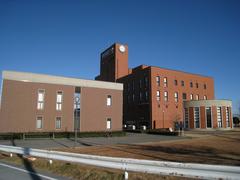 Tokyo University of Social Welfare Isesaki Campus building exterior with clear blue sky